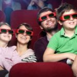 Smiling family in the movie theater